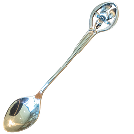 Silver decorative spoon on a white background