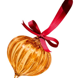 Glass bauble with red ribbon on a white background