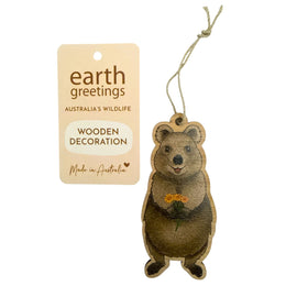 Wooden quokka decoration with a tag labeled 'earth greetings' on a white background
