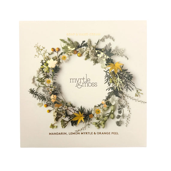 Floral wreath with 'myrtle & moss' branding on a beige background