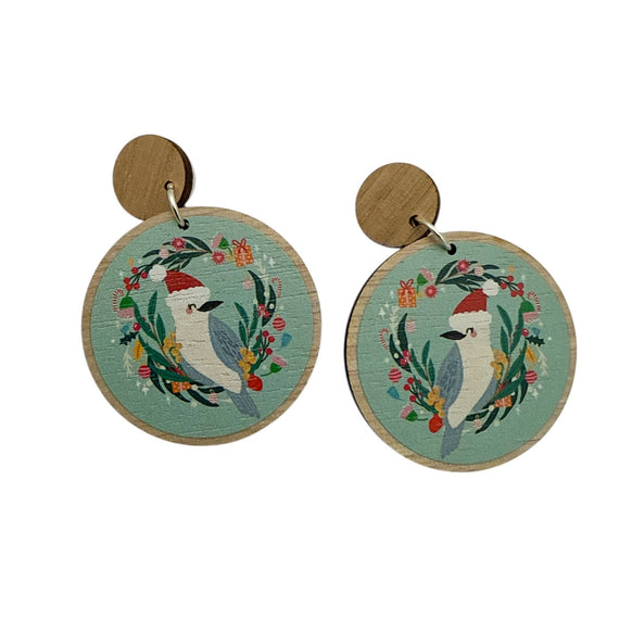 Round wooden earrings with bird design on a white background
