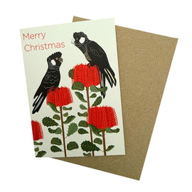 Christmas card with black birds and red flowers on a beige background