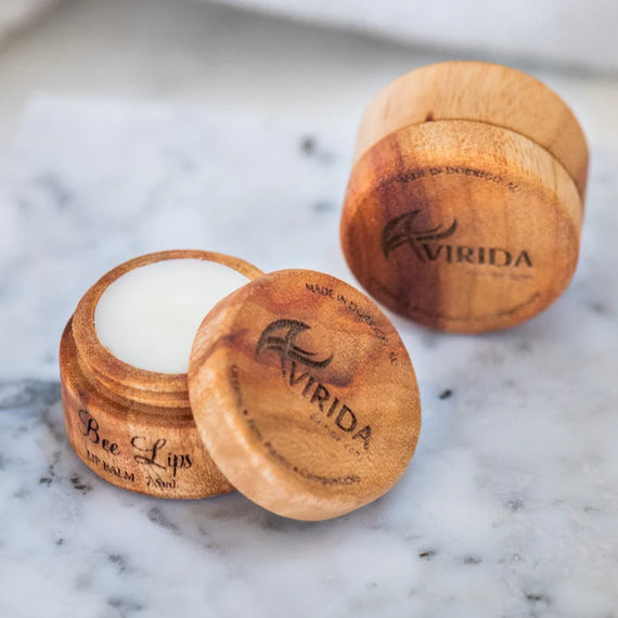 Wooden containers with 'Virida' branding on a marble surface