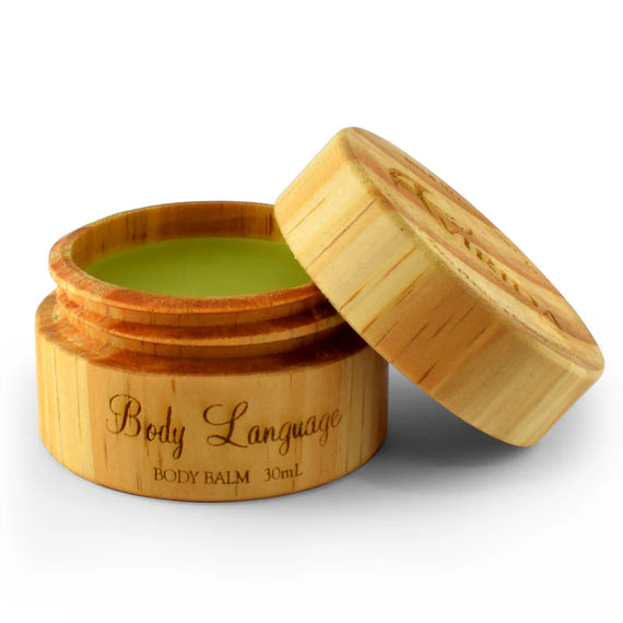 Bamboo container with body balm labeled 'Body Language' on a white background