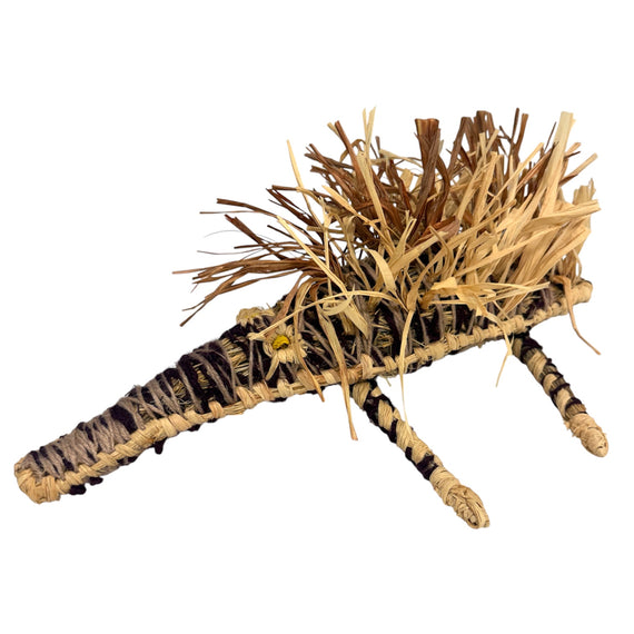 Sculpture of an echidna made from woven natural fibres on a white background