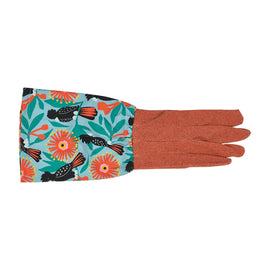 Glove with colorful floral and bird pattern on a white background