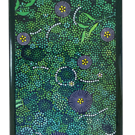 Magnet with Aboriginal art design featuring green, blue, and purple patterns.