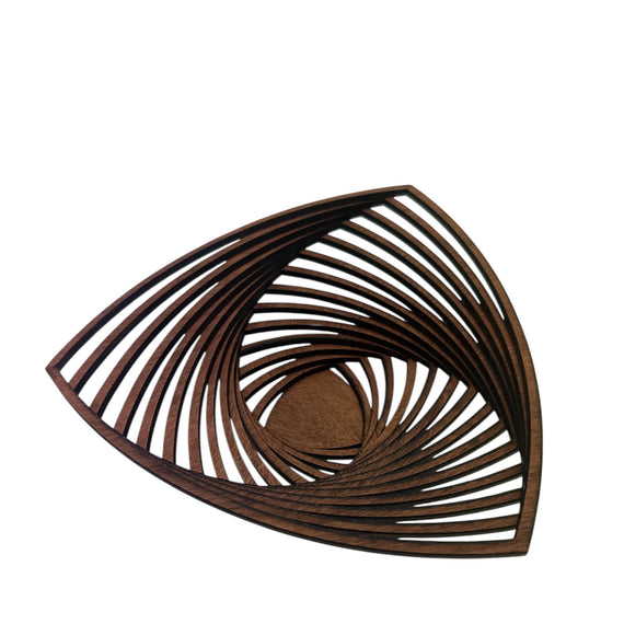 Wooden wall art with a spiral design on a white background