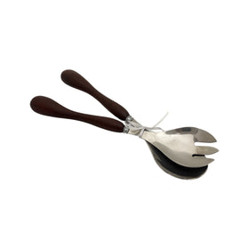 Metallic salad server with wooden handles on a white background