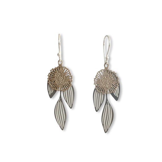 Pair of silver and gold earrings on a white background