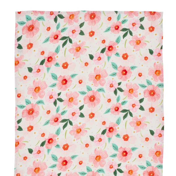 Floral patterned fabric tea towel with pink and orange flowers on a white background