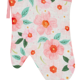 Floral patterned oven mitt on a white background