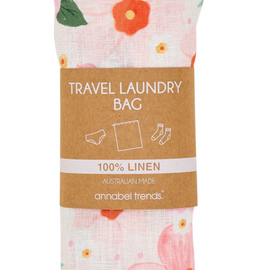 Floral travel laundry bag with a label on a white background