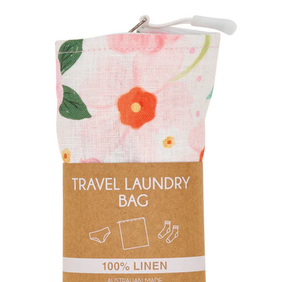 Floral travel laundry bag with a label on a white background