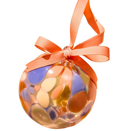 Decorative ornament with orange ribbon on a white background