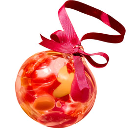 Decorative ornament with a pink ribbon on a white background