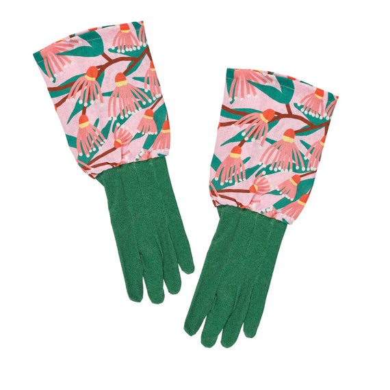Pair of green gardening gloves with pink floral pattern on a white background