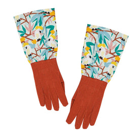 Pair of gloves with a colorful cockatoo pattern on a white background