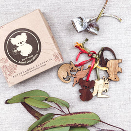 Wooden animal decorations pictured with packaging