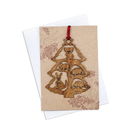 A decorative Christmas tree card made of wood, featuring a Christmas tree with animals.